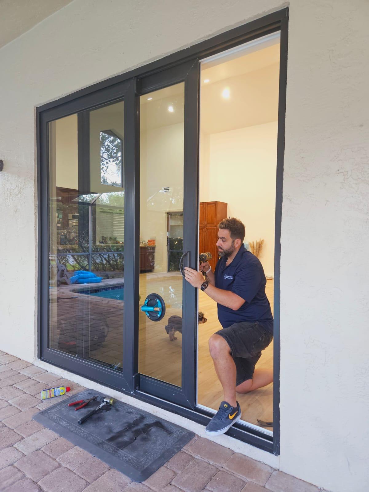 a sliding door technician repairing a patio door in south florida