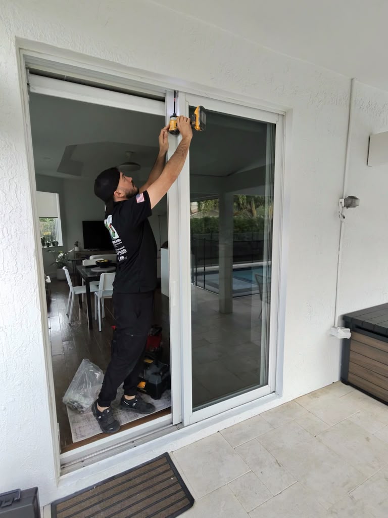 Sliding Doors Pro technician repairing sliding door frame at residential home in Broward County Florida